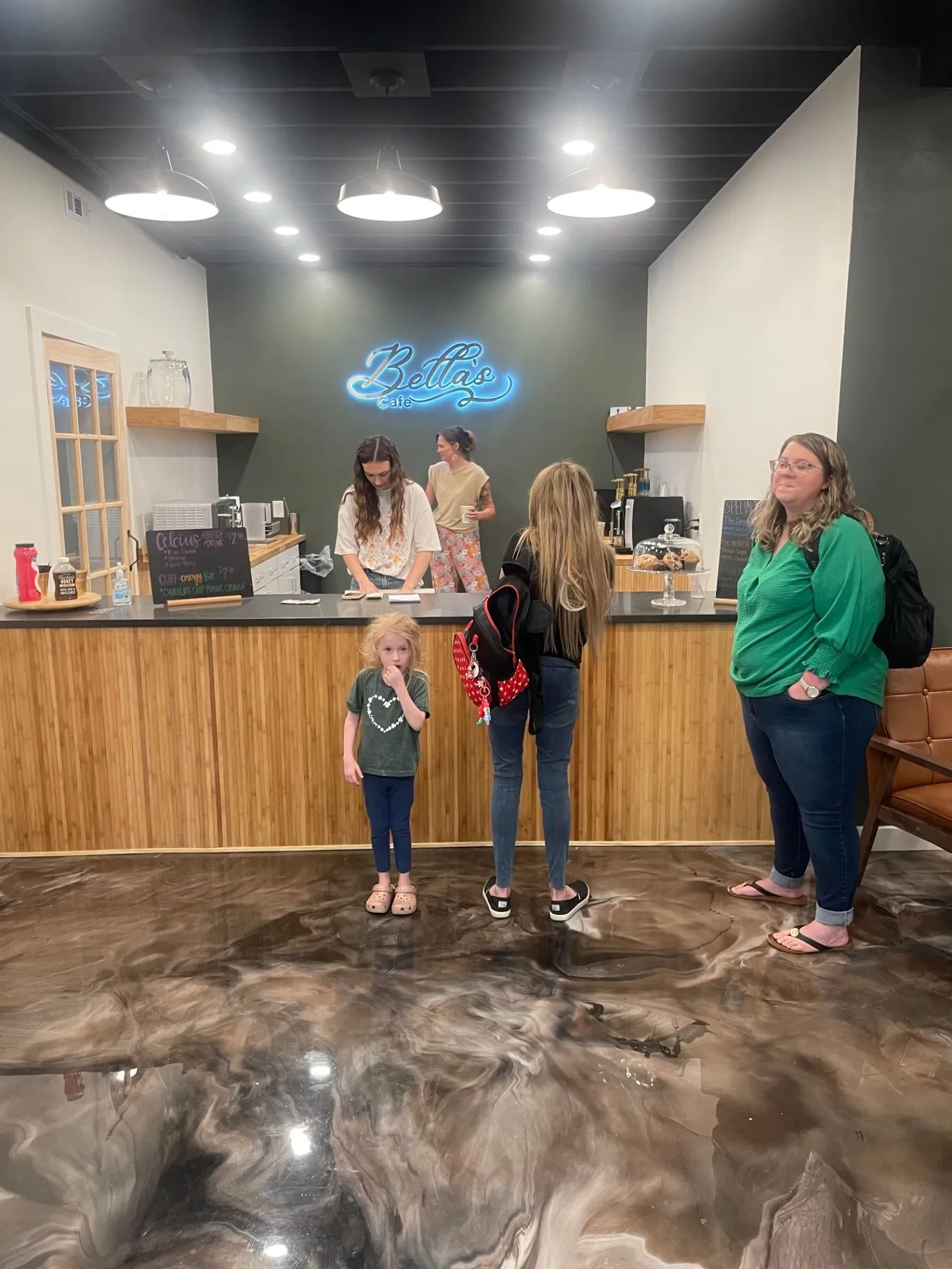 Families ordering drinks and treats at Bella’s Café inside Cornerstone Church