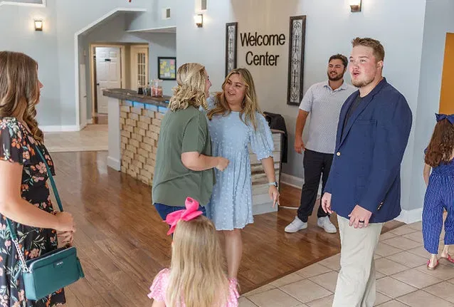 Families and friends welcoming one another at Cornerstone Church's Welcome Center