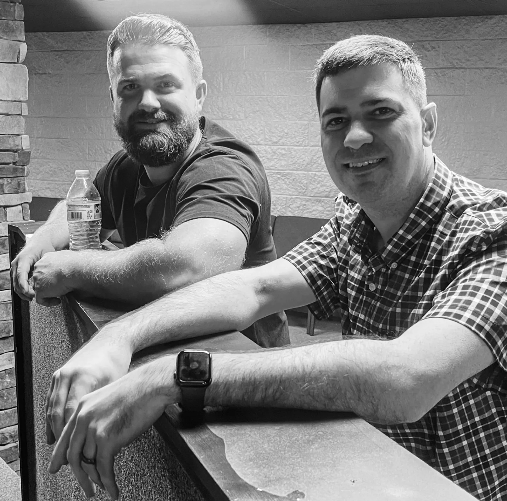 Two Cornerstone Church members visiting together inside the church