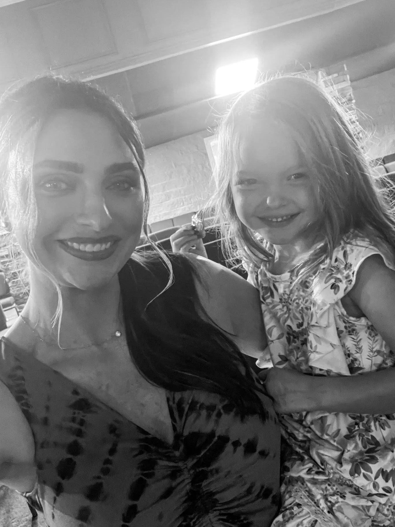 An adult and child smiling together during a Cornerstone Church gathering