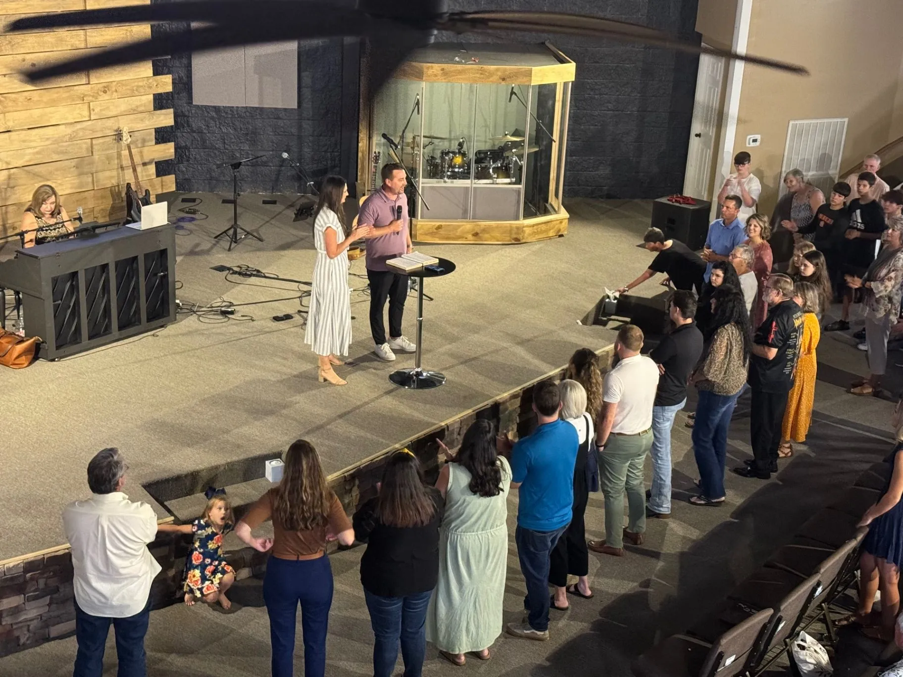 Cornerstone Church worship service with the congregation gathered near the stage